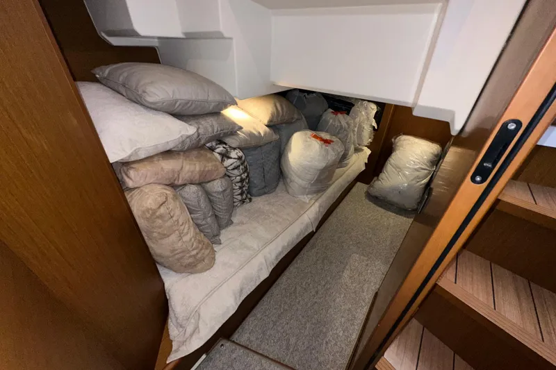 Slide: The Image of Interior storage area of 2021 Beneteau Swift Trawler 41 Fly with cushions and bags. - 52
