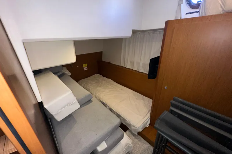 Slide: The Image of Interior cabin of 2021 Beneteau Swift Trawler 41 Fly with cozy sleeping area. - 54