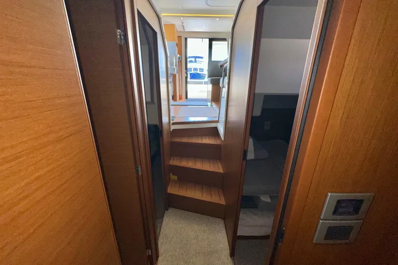 Slide: The Image of Interior hallway of 2021 Beneteau Swift Trawler 41 Fly with wooden finishes. - 61