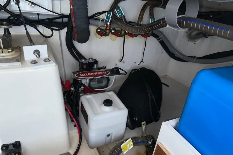 Slide: The Image of Engine room of 2021 Beneteau Swift Trawler 41 Fly with mechanical components. - 66