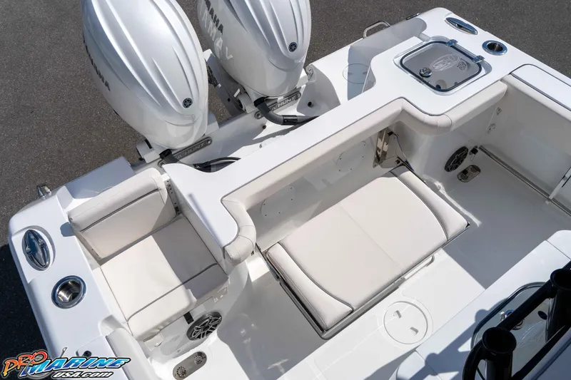 Slide: The Image of 2026 Sea Hunt Gamefish 25 boat interior with dual Yamaha engines and seating area. - 18