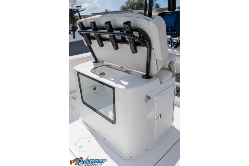 Slide: The Image of 2026 Sea Hunt Gamefish 25 boat interior with rod holders and storage compartment. - 19