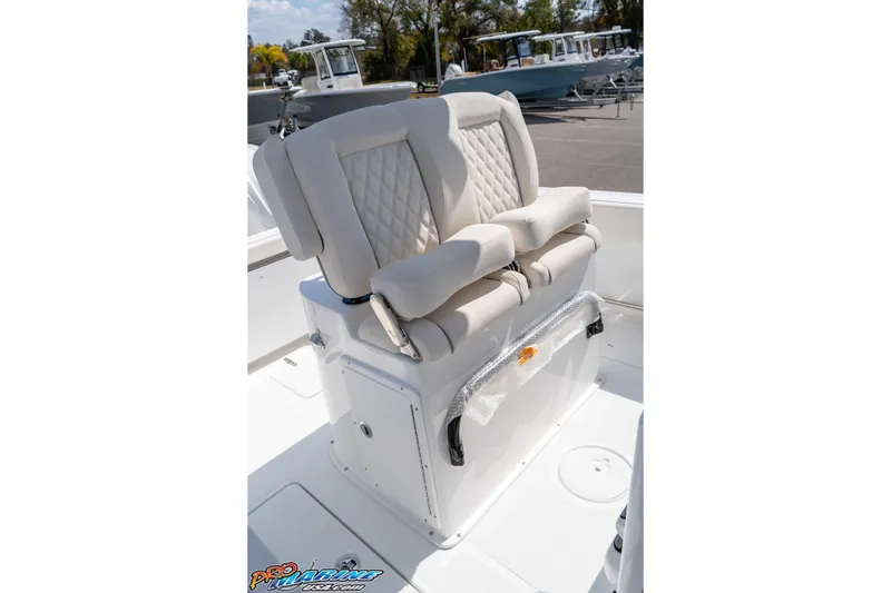 Slide: The Image of 2026 Sea Hunt Gamefish 25 boat seating with cushioned backrests and storage compartment. - 23