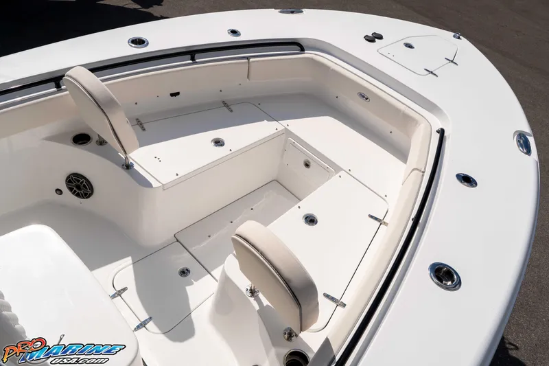 Slide: The Image of 2026 Sea Hunt Gamefish 25 boat interior with seating and storage compartments. - 25