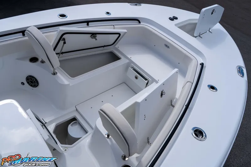 Slide: The Image of 2026 Sea Hunt Gamefish 25 boat interior with open storage compartments and seating. - 26