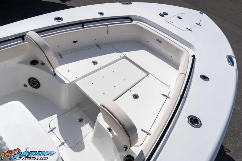 Slide: The Image of 2026 Sea Hunt Gamefish 25 boat interior with seating and storage compartments. - 27