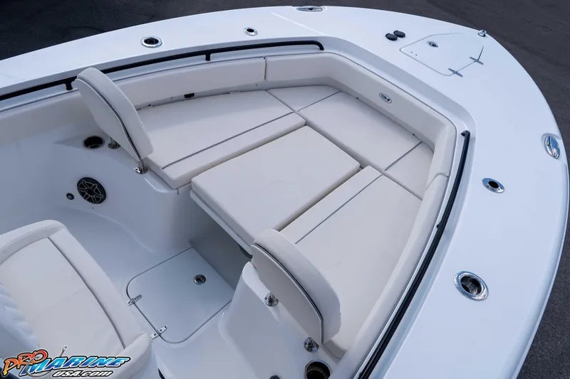 Slide: The Image of 2026 Sea Hunt Gamefish 25 boat interior with cushioned seating and storage compartments. - 28