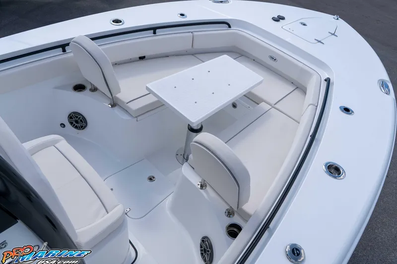 Slide: The Image of 2026 Sea Hunt Gamefish 25 boat interior with seating and table setup. - 29