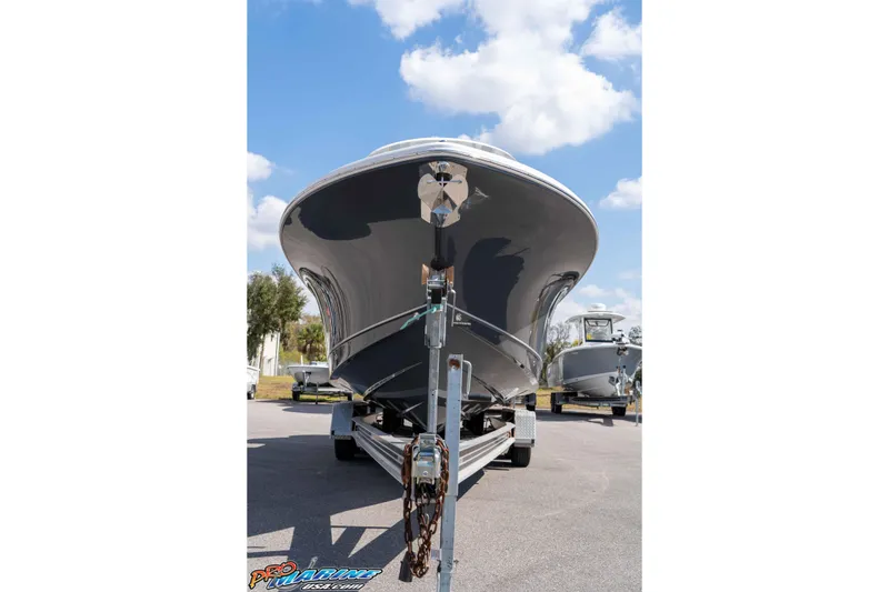 Slide: The Image of 2026 Sea Hunt Gamefish 25 boat on trailer under blue sky. - 3