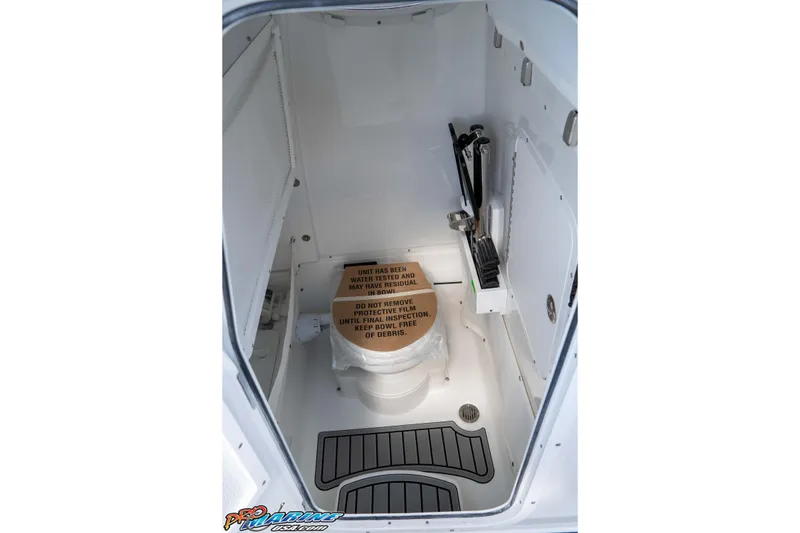 Slide: The Image of 2026 Sea Hunt Gamefish 25 boat interior with toilet and protective film. - 30