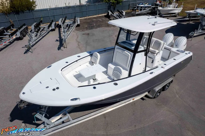 Slide: The Image of 2026 Sea Hunt Gamefish 25 boat on trailer, featuring sleek design and spacious deck. - 33