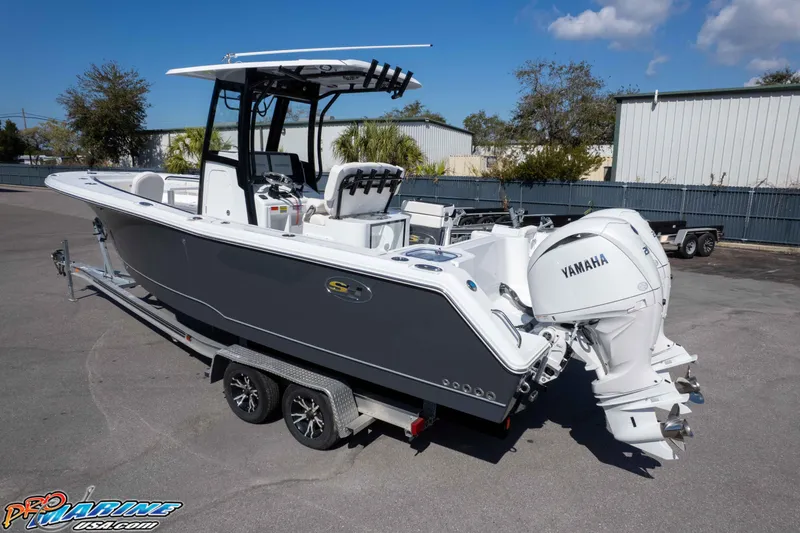 Slide: The Image of 2026 Sea Hunt Gamefish 25 boat with Yamaha engines on a trailer. - 38