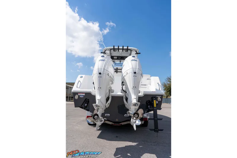 Slide: The Image of 2026 Sea Hunt Gamefish 25 boat with dual outboard engines, viewed from the rear. - 9