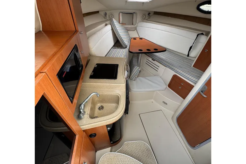 Slide: The Image of Interior of 2008 Wellcraft 290 Coastal with kitchenette and seating area. - 10