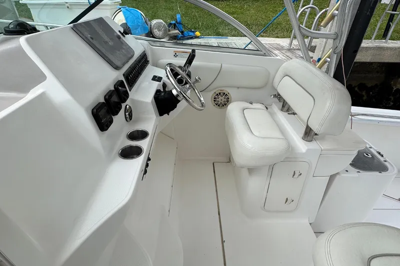 Slide: The Image of Interior of a 2008 Wellcraft 290 Coastal boat, helm and seating area. - 4