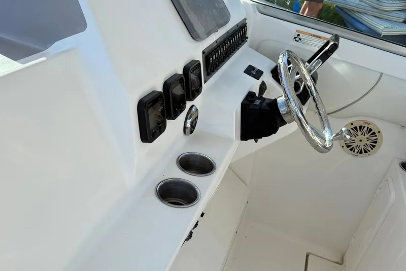 Slide: The Image of 2008 Wellcraft 290 Coastal helm with stainless steel steering wheel. - 7