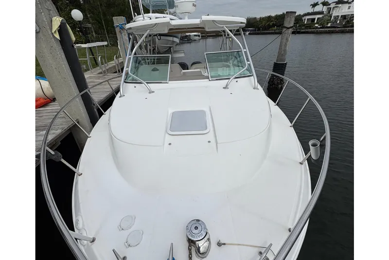 Slide: The Image of 2008 Wellcraft 290 Coastal boat docked. - 8