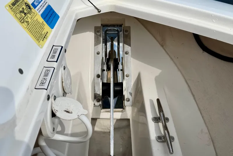 Slide: The Image of 2019 Pursuit S 328 Sport boat interior showing fresh and raw water access. - 13