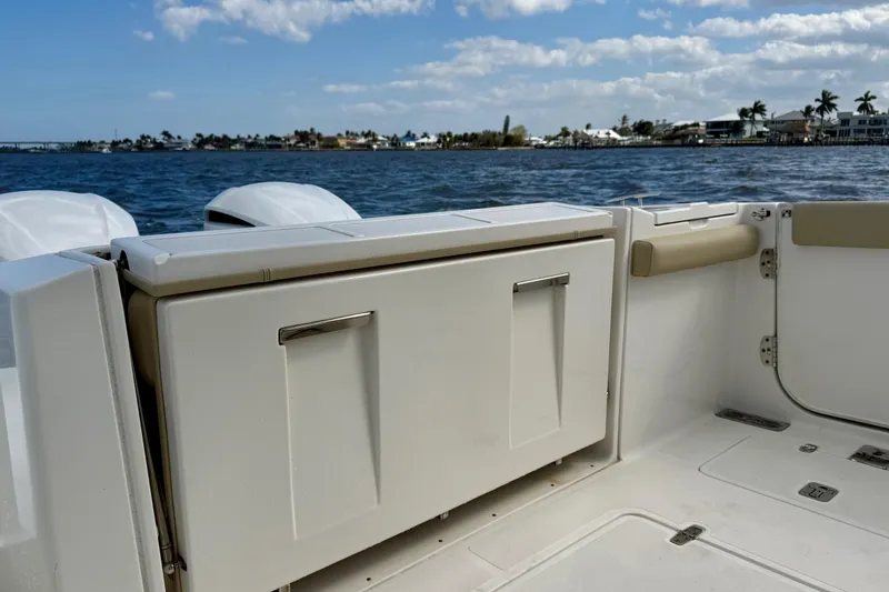 Slide: The Image of 2019 Pursuit S 328 Sport boat interior with ocean view and clear sky. - 15