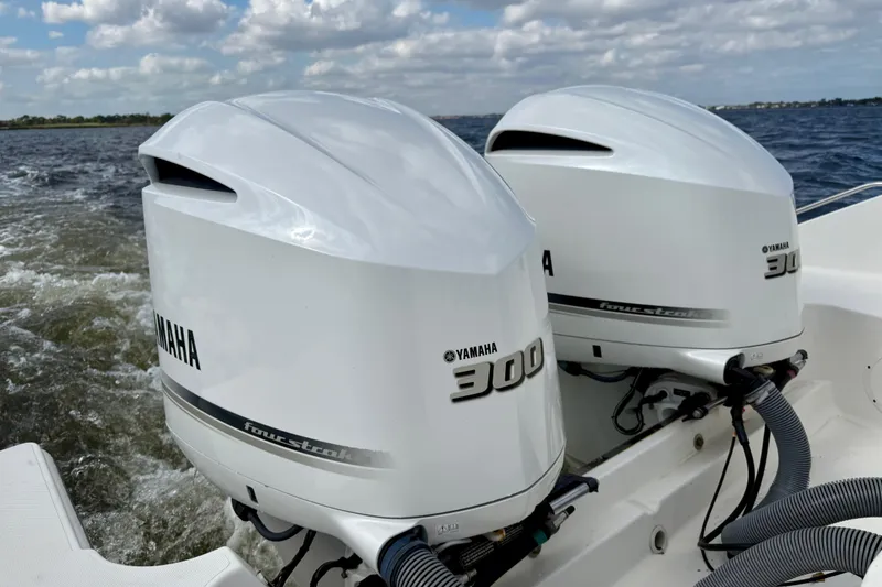 Slide: The Image of Twin Yamaha 300 outboard engines on a 2019 Pursuit S 328 Sport boat. - 22