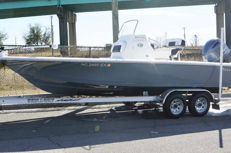 The Image of 2022 Tidewater 2110 Bay Max boat on trailer, parked under a bridge. - 1