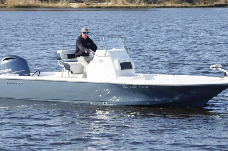 Slide: The Image of 2022 Tidewater 2110 Bay Max boat cruising on a calm lake. - 4