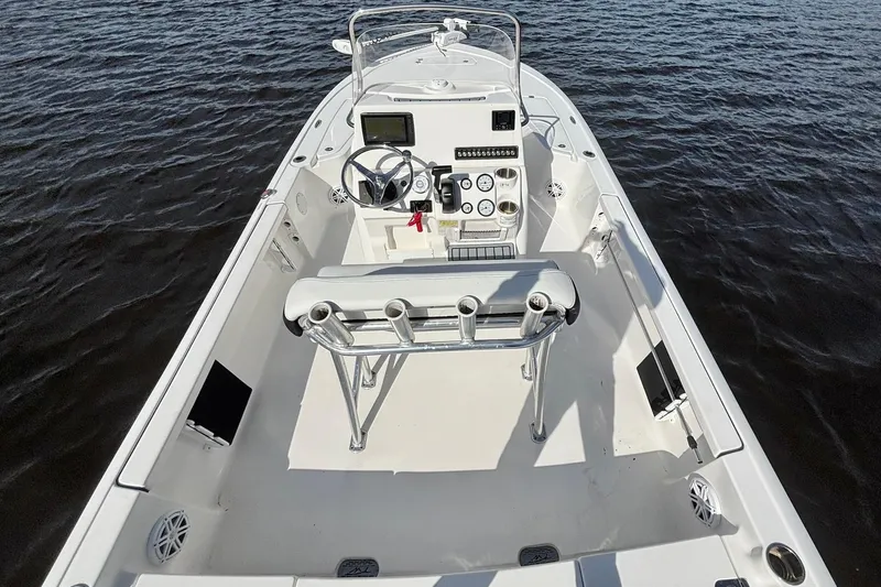 Slide: The Image of 2022 Tidewater 2110 Bay Max boat interior with steering console on water. - 8