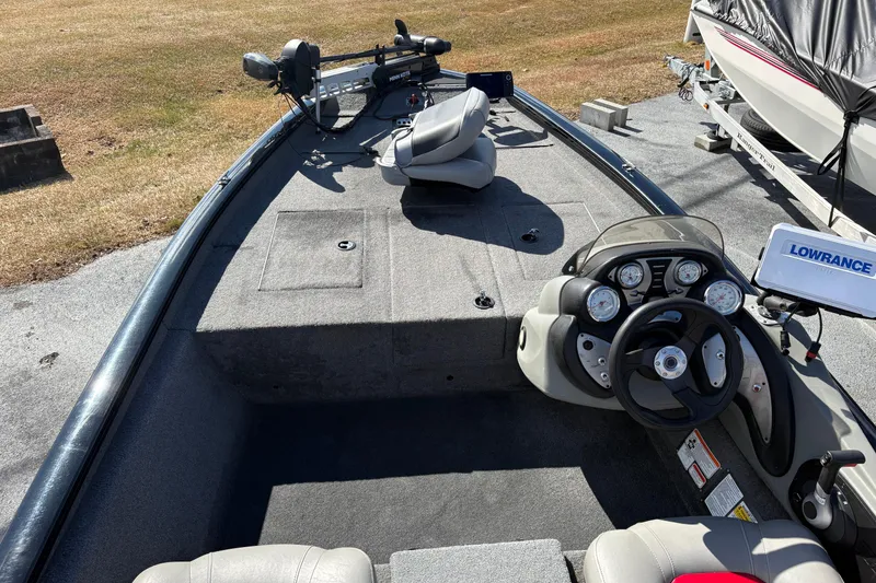 Slide: The Image of 2017 Tracker Pro Team 175 TXW boat interior with steering console and fishing equipment. - 4