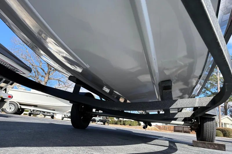 Slide: The Image of 2017 Tracker Pro Team 175 TXW boat on trailer, underside view, parked outdoors. - 6