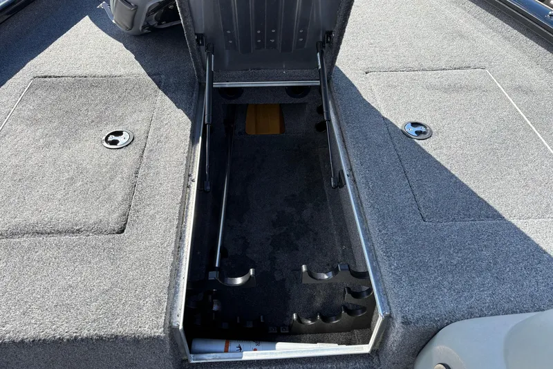 Slide: The Image of 2017 Tracker Pro Team 175 TXW boat with open storage compartment. - 7