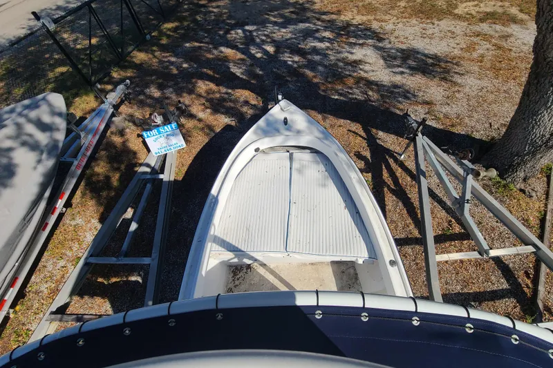 Slide: The Image of 1969 Aquasport 222 Center Console boat for sale, parked on a trailer. - 15