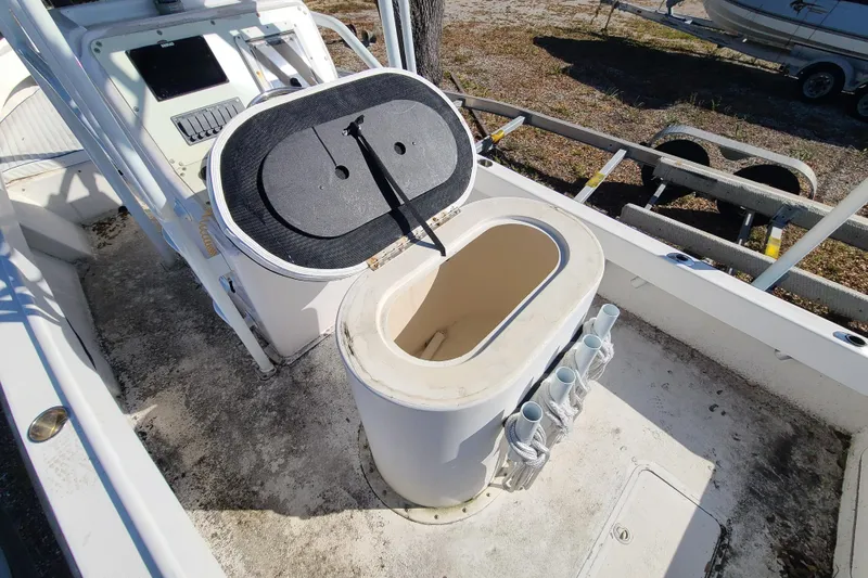 Slide: The Image of 1969 Aquasport 222 Center Console boat interior with open storage compartment. - 17