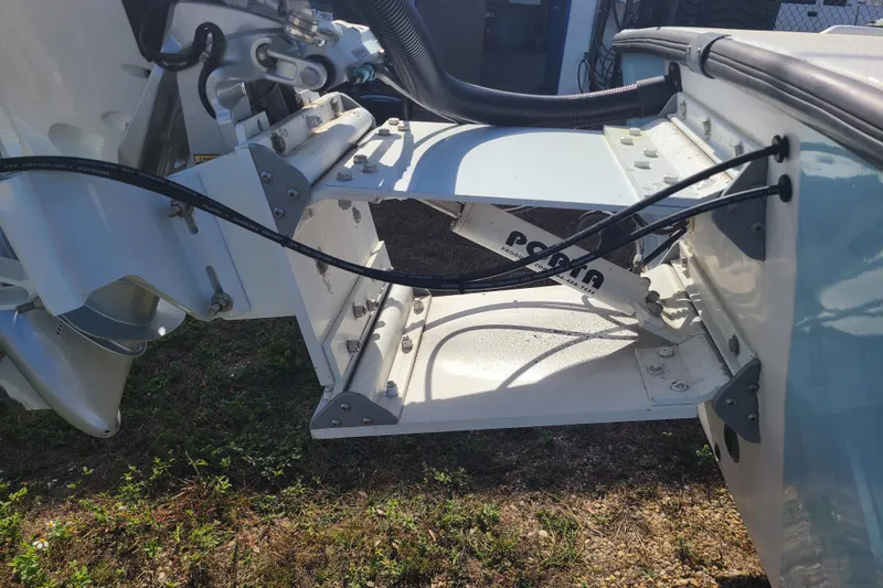 Slide: The Image of 1969 Aquasport 222 Center Console boat transom with hydraulic components and cables. - 23