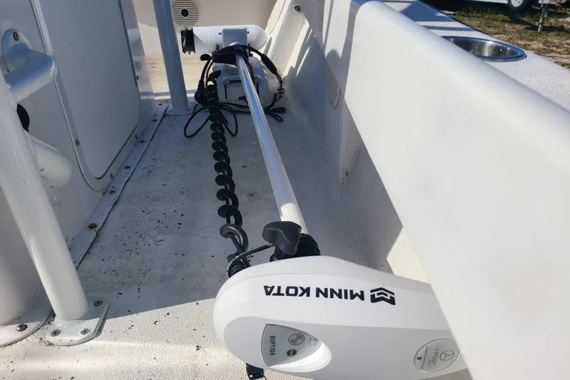 Slide: The Image of 1969 Aquasport 222 Center Console with Minn Kota trolling motor on deck. - 24