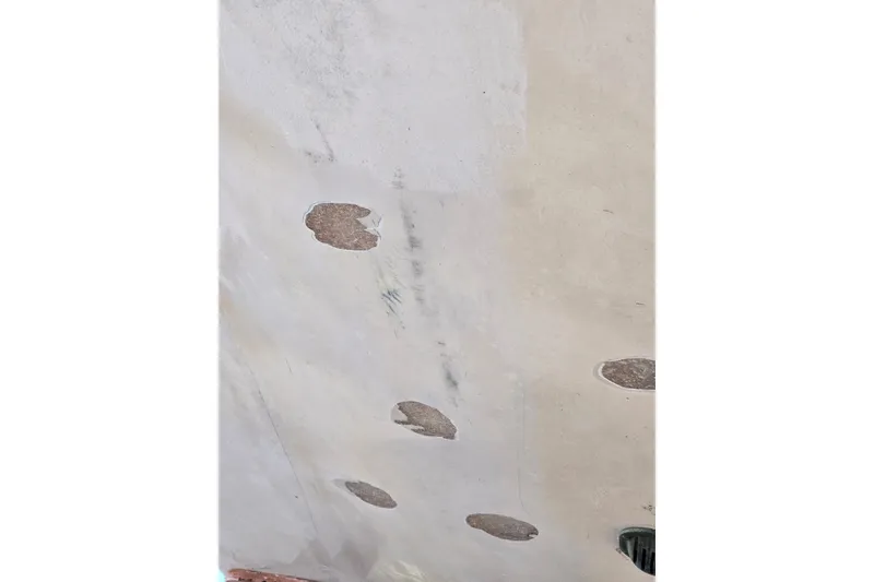 Slide: The Image of 1969 Aquasport 222 Center Console hull with visible surface damage and wear. - 28