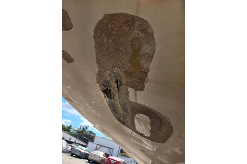 Slide: The Image of 1969 Aquasport 222 Center Console hull damage, showing fiberglass repair area. - 33