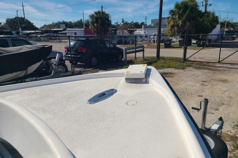 Slide: The Image of 1969 Aquasport 222 Center Console boat on trailer in outdoor storage area. - 4
