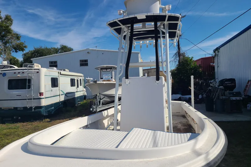 Slide: The Image of 1969 Aquasport 222 Center Console boat in storage yard with RVs and equipment. - 6