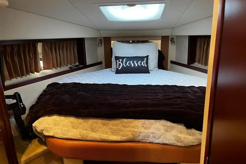 Slide: The Image of Cozy bedroom in 2007 Sea Ray 38 Sundancer yacht with "Blessed" pillow. - 13