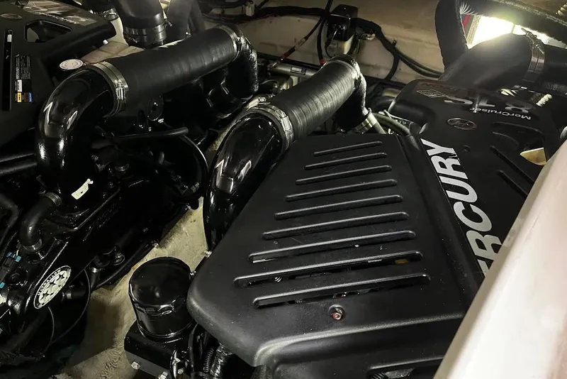 Slide: The Image of Engine compartment of a 2007 Sea Ray 38 Sundancer with Mercury components. - 23