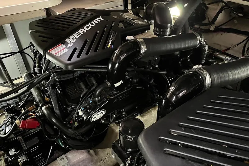 Slide: The Image of Engine compartment of a 2007 Sea Ray 38 Sundancer with Mercury engines. - 24