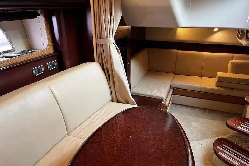 Slide: The Image of Luxurious interior of 2007 Sea Ray 38 Sundancer yacht with leather seating and wood accents. - 25