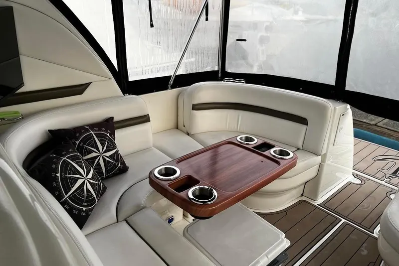 Slide: The Image of Luxurious 2007 Sea Ray 38 Sundancer interior with elegant seating and wooden table. - 3