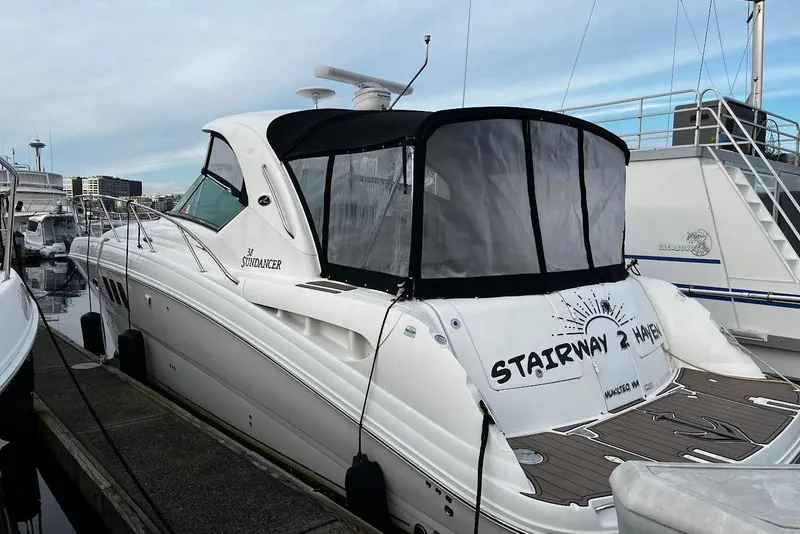 Slide: The Image of 2007 Sea Ray 38 Sundancer yacht docked at marina, named "Stairway 2 Haven." - 5