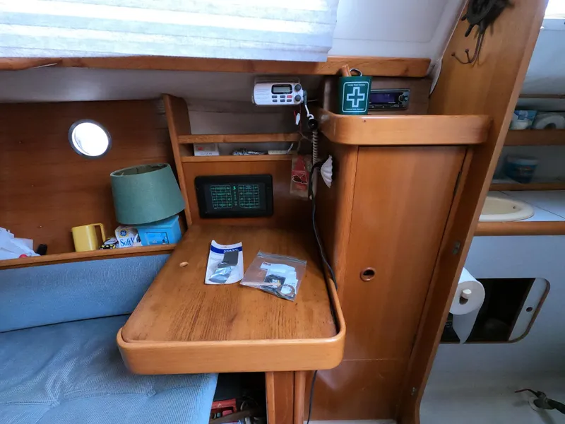 Slide: The Image of Interior of a 1990 Beneteau First 285 yacht with wooden furnishings. - 22