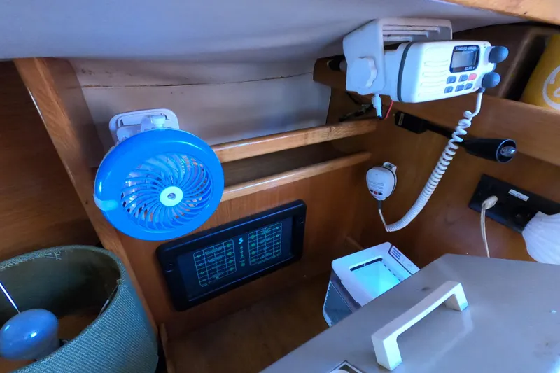 Slide: The Image of Interior of a 1990 Beneteau First 285 sailboat with fan and radio equipment. - 23