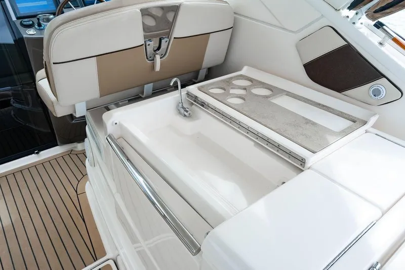 Slide: The Image of 2013 Tiara Yachts 3600 Coronet interior with sink and seating area. - 17