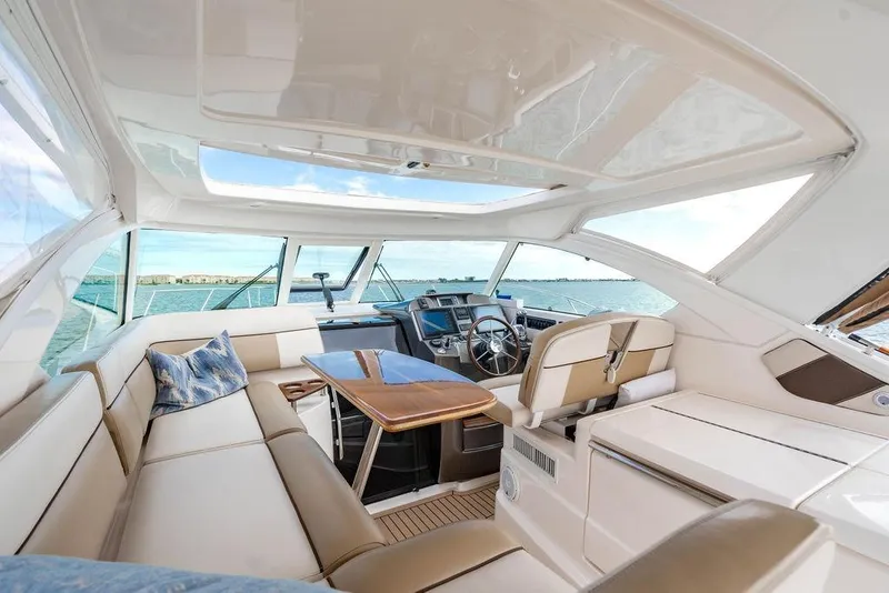 Slide: The Image of Luxurious interior of 2013 Tiara Yachts 3600 Coronet, featuring elegant seating and helm. - 27