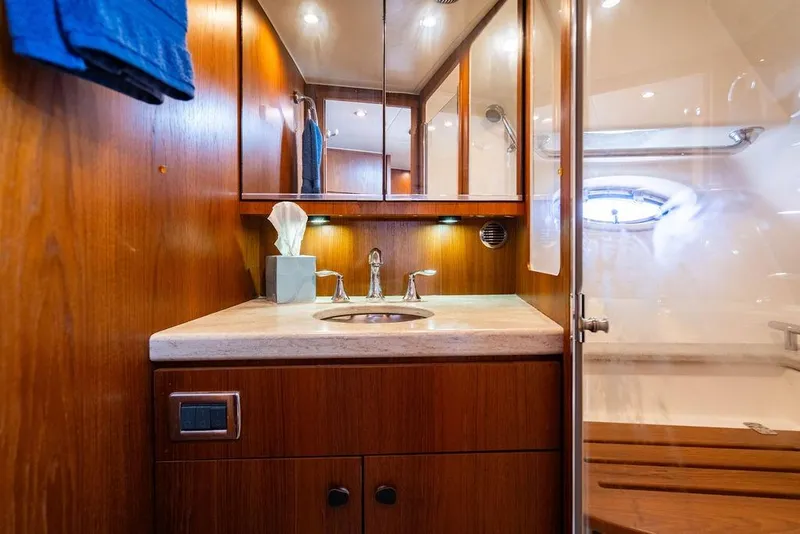 Slide: The Image of Luxurious 2013 Tiara Yachts 3600 Coronet bathroom with wood cabinetry and modern fixtures. - 29