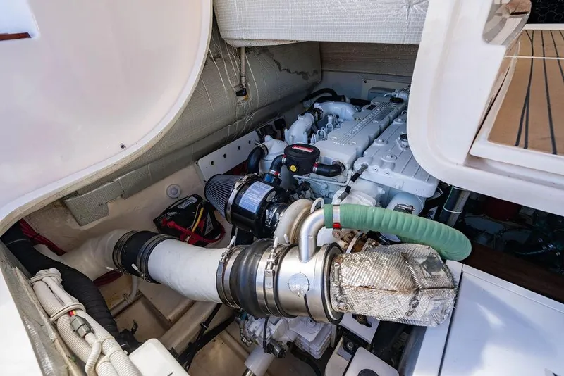 Slide: The Image of Engine compartment of 2013 Tiara Yachts 3600 Coronet, showcasing detailed mechanical components. - 34